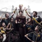 Anthony Hopkins sits on a throne surrounded by gladiators in Amazon