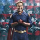 Homelander smiles as he clasps his hands in front of some armed US soldiers in The Boys season 4, which precedes The Boys season 5