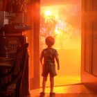 A little boy staring at a bright orange light outside of his house in "Close Encounters of the Third Kind"