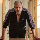 Zeus looks unimpressed as he leans on a table in Netflix's Kaos TV show