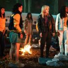 The young "Yellowjackets" season 1 cast gathered around a fire