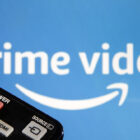 In this photo illustration, a remote control is seen in front of a television screen showing a Prime Video logo on March 28, 2020 in Paris, France.