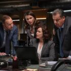 Danny, Baez, Erin, and Anthony look at some information on Baez