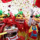 BEIJING, CHINA - JANUARY 22:   Chinese folk artists perform the lion dance at a temple fair to celebrate the Lunar New Year of Dragon on January 22, 2012 in Beijing, China. Falling on January 23 this year, the Chinese Lunar New Year, also known as the Spring Festival, which is based on the Lunisolar Chinese calendar, is celebrated from the first day of the first month of the lunar year and ends with Lantern Festival on the Fifteenth day.  (Photo by Feng Li/Getty Images)