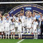 DOHA, QATAR - DECEMBER 18: Kylian Mbappe of Real Madrid lifts the 2024 FIFA Intercontinental Cup trophy as Real Madrid players celebrate their victory at the end of the FIFA Intercontinental Cup between Real Madrid and CF Pachuca at Lusail Stadium on December 18, 2024 in Doha, Qatar.  (Photo by Christopher Pike - FIFA/FIFA via Getty Images)