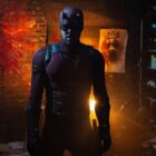 Daredevil standing in a dimly-lit room in Daredevil: Born Again