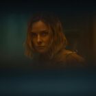 Juliette as seen through a small letter box in Silo season 2
