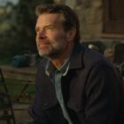 Scott Foley as Eric looking out at the small Italian village