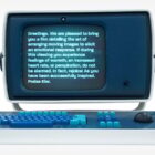 A retro-style computer with a blue screen displays text about film-induced emotional responses. The computer features a blue and teal keyboard and a joystick, evoking a vintage aesthetic.