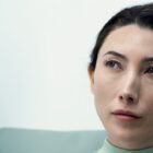 A close up of Gemma sitting down in Severance season 2 episode 7
