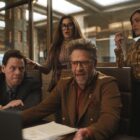 Ike Barinholtz, Kathryn Hahn and Chase Sui Wonders around Seth Rogen at a desk in The Studio