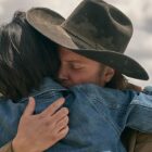 Kelsey Asbille as Monica Long and Luke Grimes as Kacey Dutton embrace in Yellowstone season 5, part 2