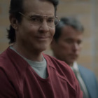 Dennis Quaid as the Happy Face Killer wearing a red jumpsuit