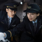 A couple of train crew look on in fear in Bullet Train Explosion.