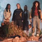 The cast of Yellowjackets surrounding Misty