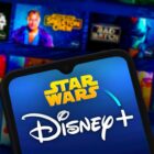 Disney Plus Star Wars app page and mobile phone