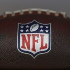 A detail view of the NFL Shield logo on a ball during rookie minicamp at CrossCountry Mortgage Campus on May 10, 2025 in Berea, Ohio.