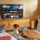 Amazon Fire Tv with Prime Video on screen in a living room with family.
