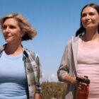 Carol and Zosia standing and smiling in a desert area in Pluribus episode 8