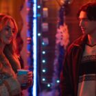 Lucy and Stephen talk at a party