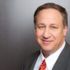 AMC Theatres CEO Adam Aron Lauds ‘Besties’ Netflix Relationship