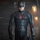 Daredevil with his head bowed as he walks through a big hallway in Daredevil: Born Again season 2