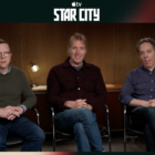 three men in a press room