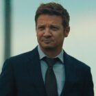 Jeremy Renner looks at something offscreen