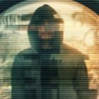 A pixelated image of a man in a hoodie through the perspective of a doorbell cam..