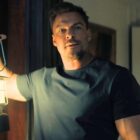 Reacher holds a lantern