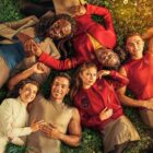 The cast of Starfleet Academy lie on the grass