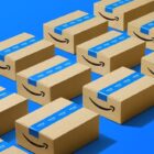 A row of brown Amazon packages with blue tape on them on a blue background