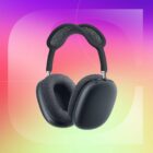 A pair of black headphones against a red, purple and yellow gradient CNET background.
